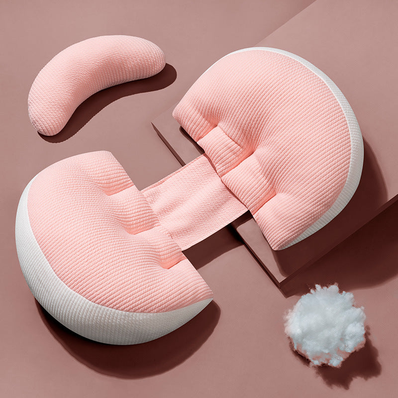 Coussin de soutien ergonomique Be'Link rose de BEBLY, conçu pour la grossesse, soulageant le dos, le ventre et les jambes.